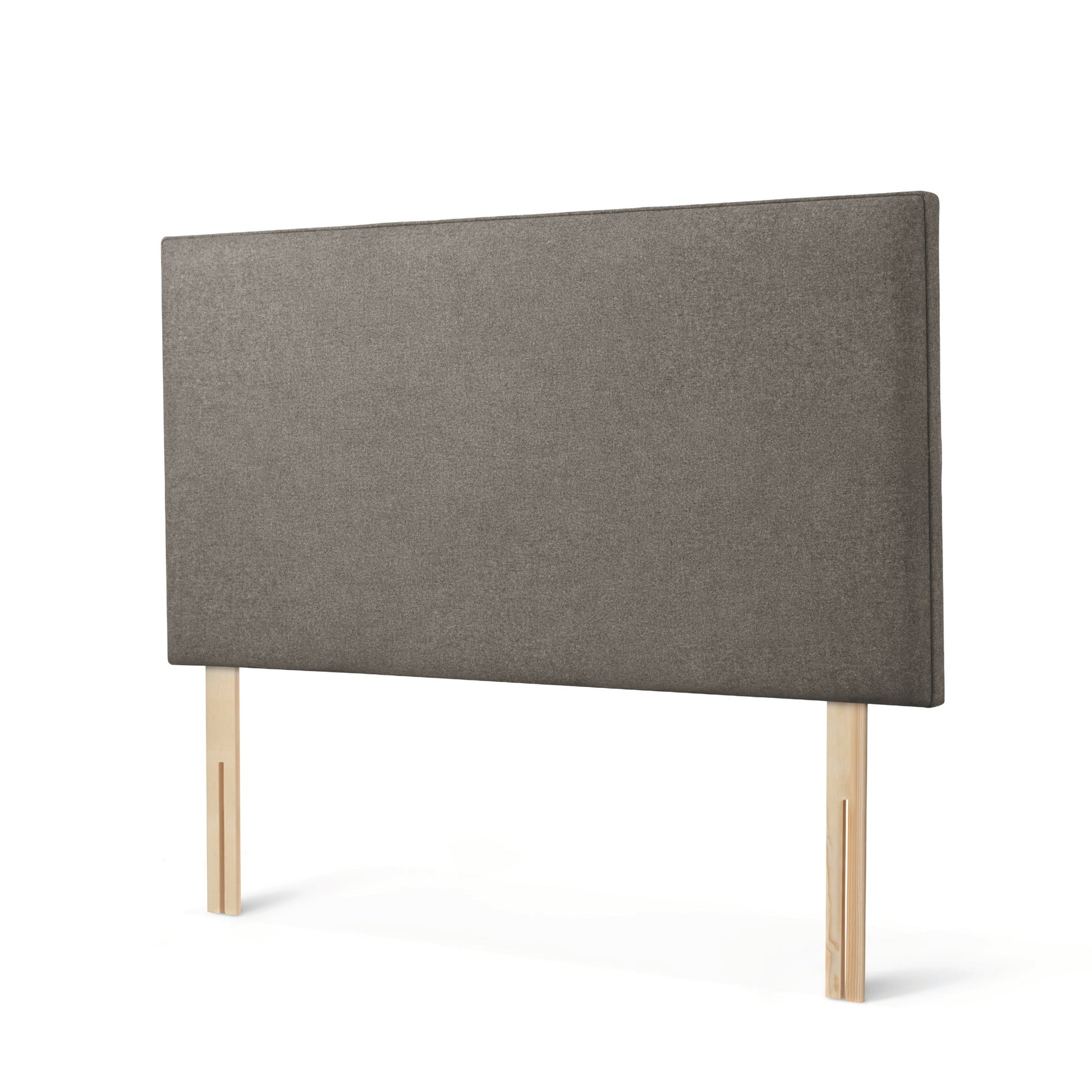 The Woolroom Broadway Strutted Headboard in dark grey upholstery is a stylish bed-fix addition to a bed.