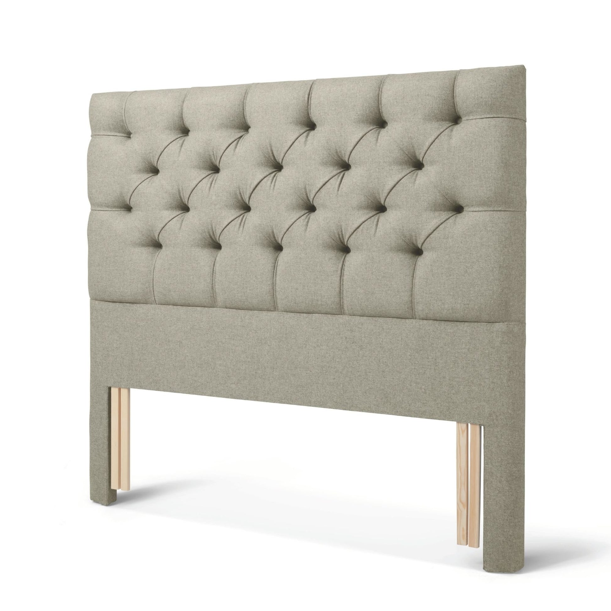 The Woolroom Nuffield Floor Standing Headboard in Light Grey has a traditional British buttoning for a tufted design.