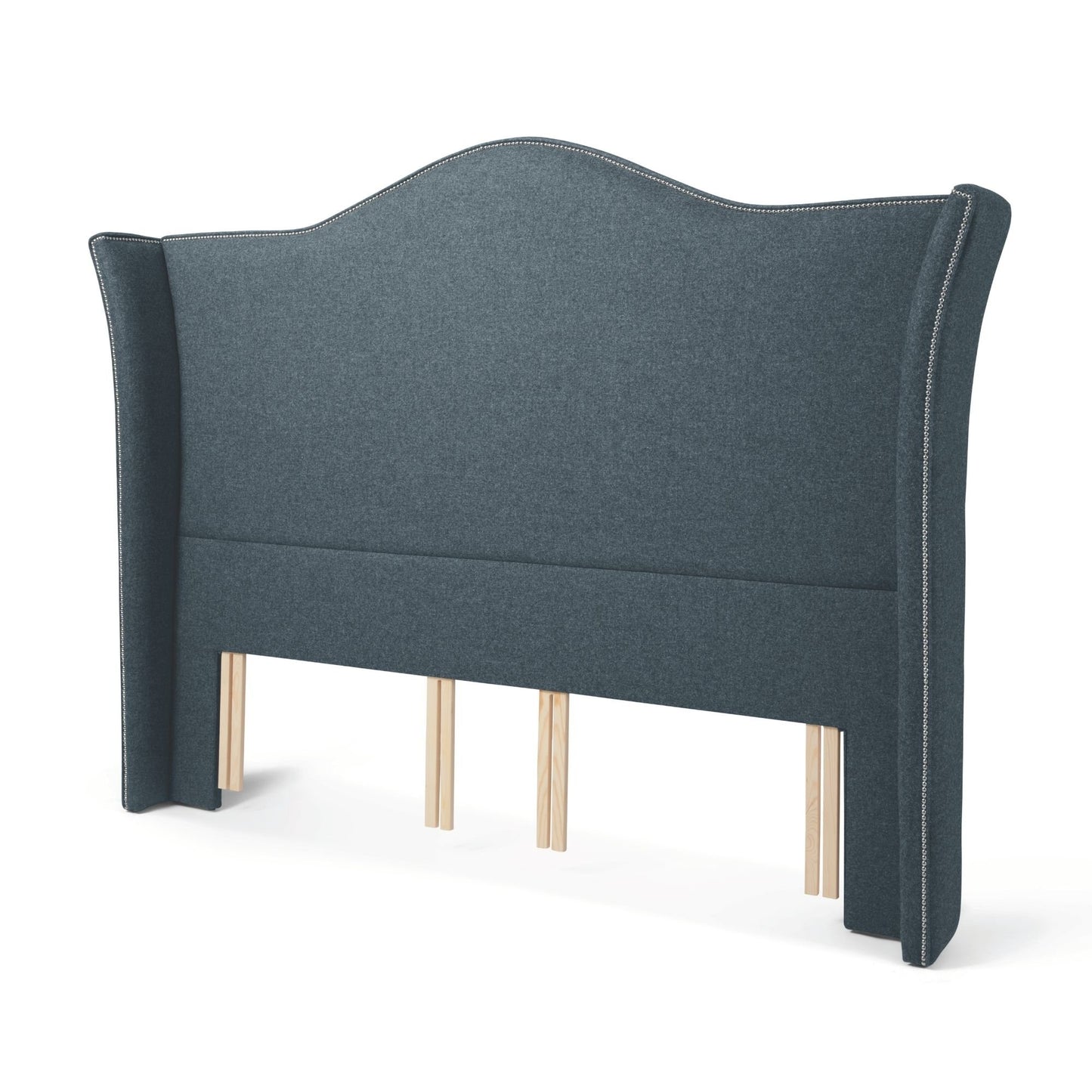 The Stoneywell Floor Standing Headboard in Hemlock blue upholstery is a grand design with wings and nailhead trim.