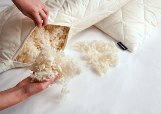 Lady playing with wool stuffing