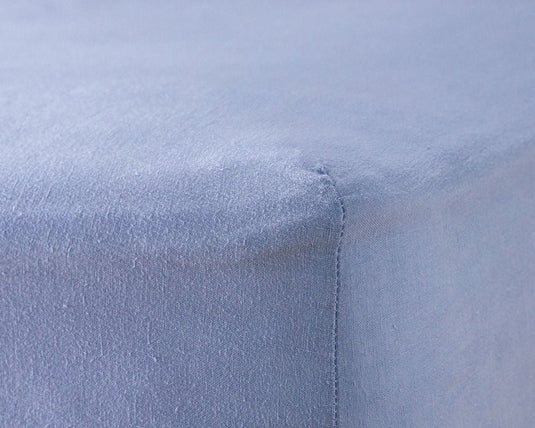 Close-up of a light blue fabric with a subtle pattern