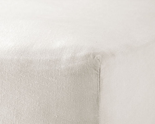 Close-up of a textured white pillow on a light gray background