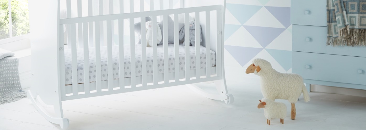 cot and model sheep in child's room