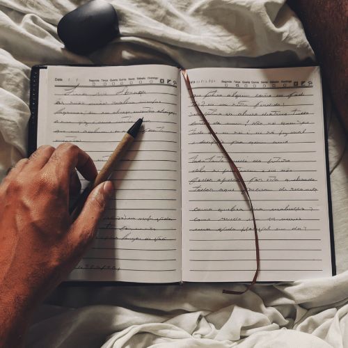 Person writing in a notebook