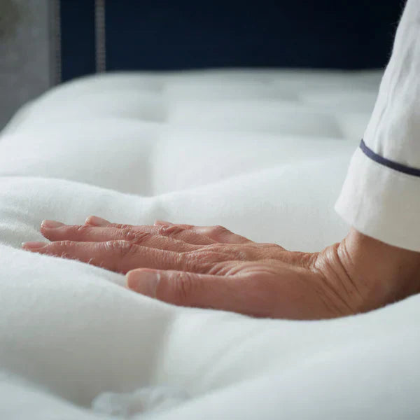 pushing down on the mattress