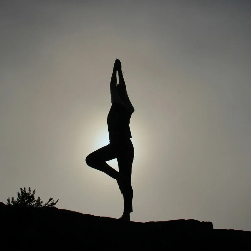 7 Yoga Poses For Sleep Success - Lady doing Yoga pose