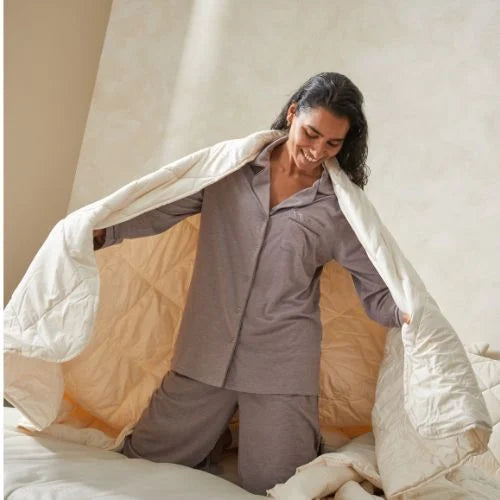 Woman wrapping with woolroom comforter