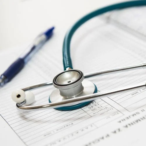 A stethoscope and doctor notes