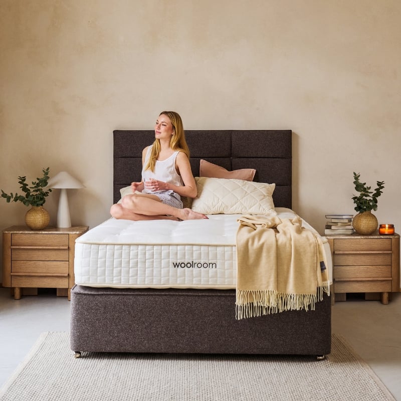 Women sitting on mattress looking out the window
