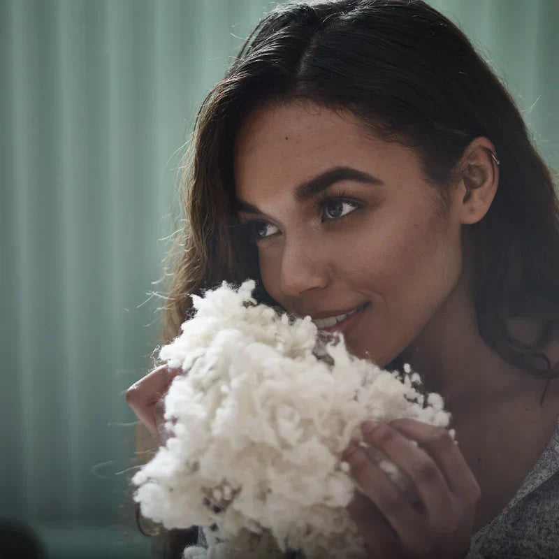 women smelling wool