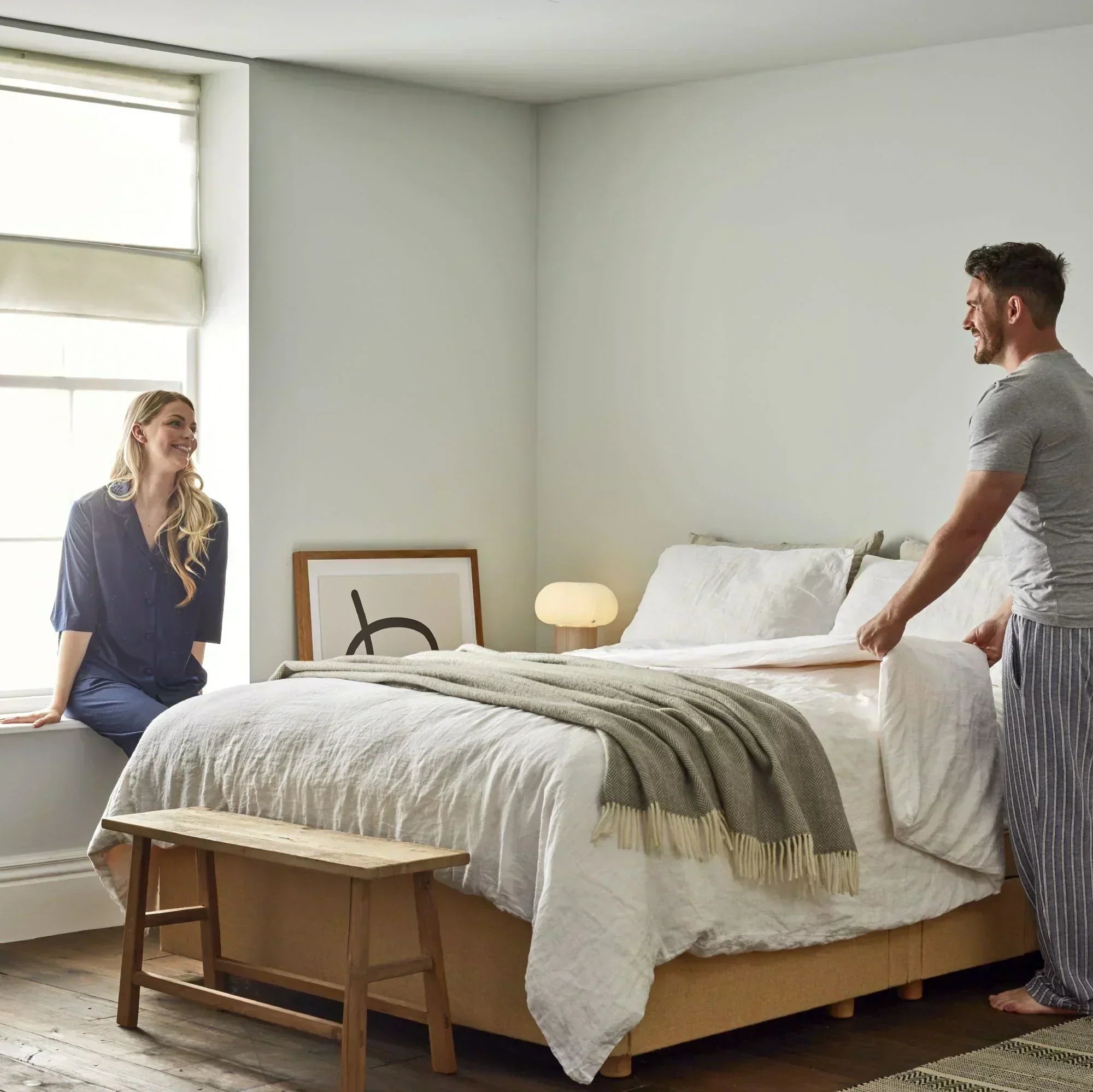 Your side or mine? Get closer with temperature regulating bedding - Couple making bed