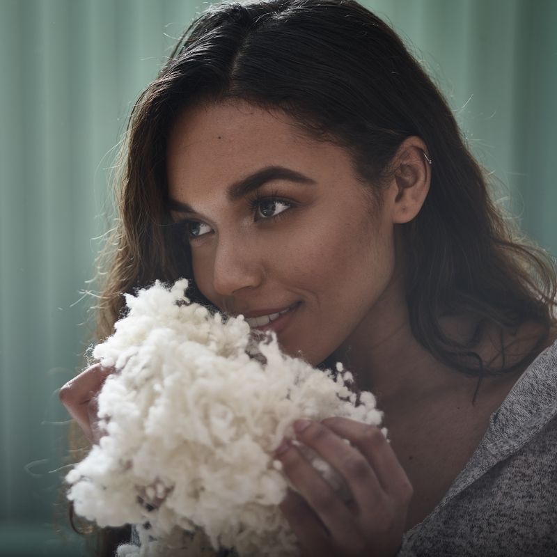 Lady sniffing wool