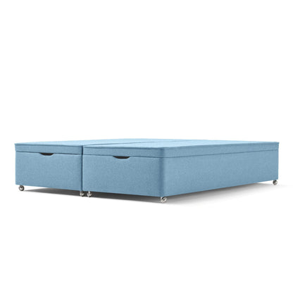 The Woolroom Kingston Upholstered Ottoman Divan with silver castors in Juniper light blue upholstery offers extra storage.