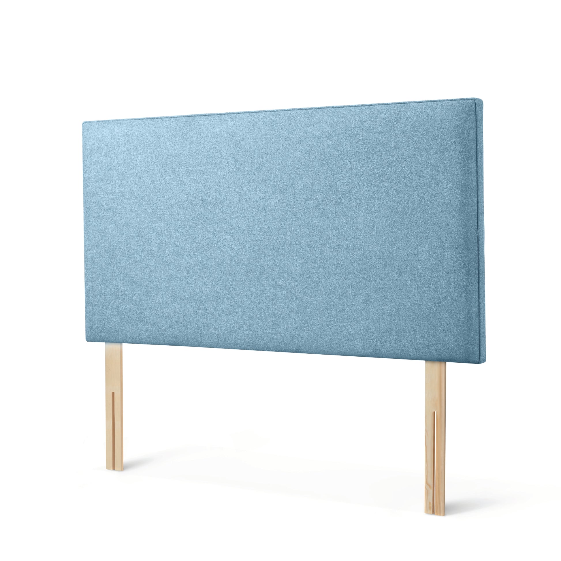 The Woolroom Broadway Strutted Headboard in Juniper light blue upholstery is a stylish bed-fix addition to a bed.