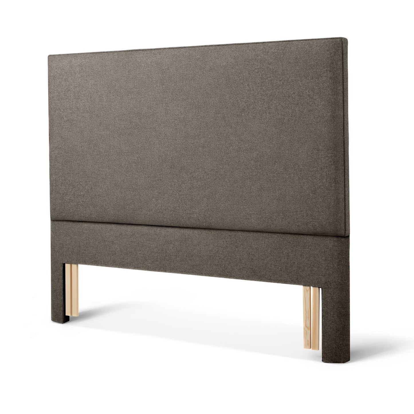 The Woolroom Broadway Floor Standing Headboard in dark grey upholstery can be added seamlessly to a bed. 