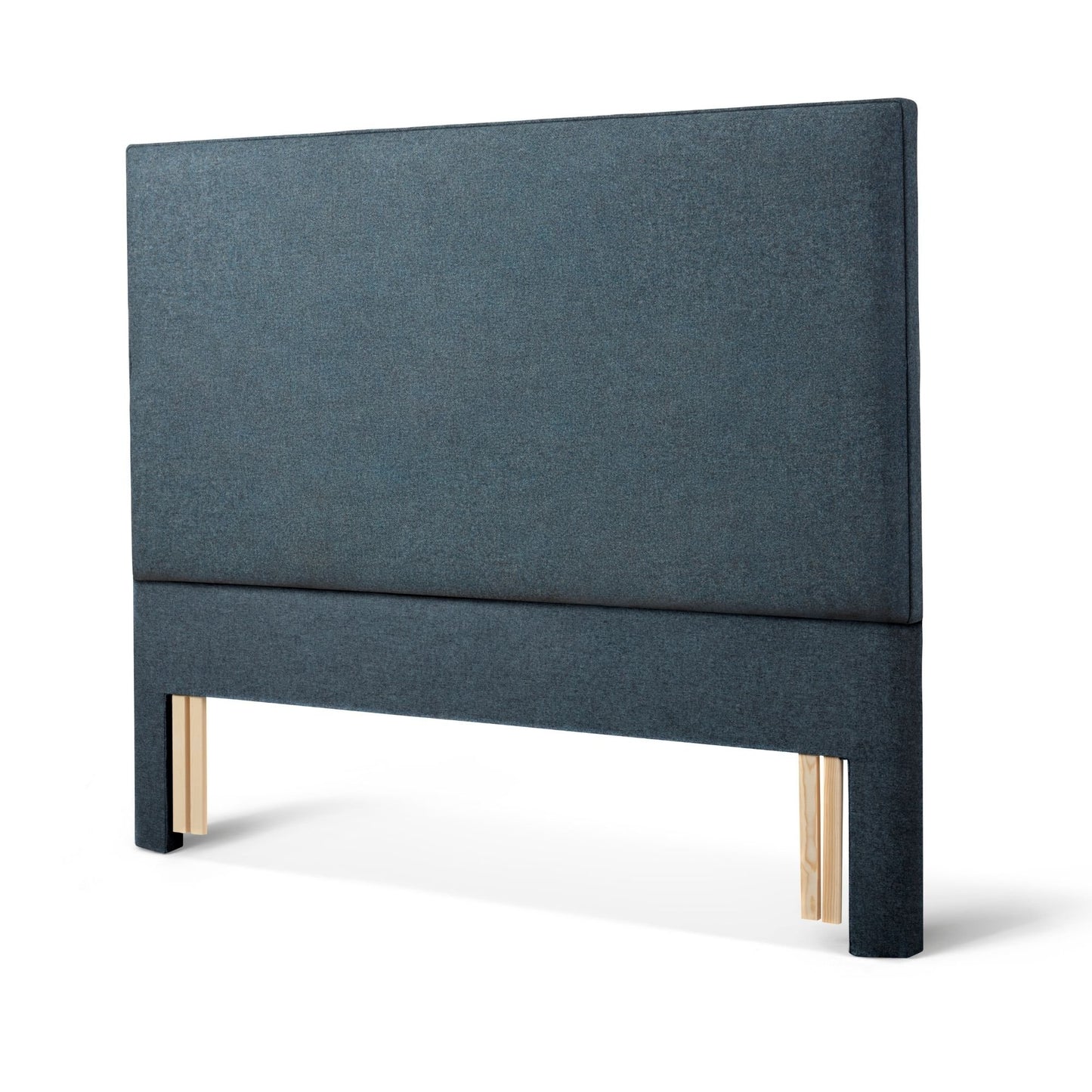 The Woolroom Broadway Floor Standing Headboard in Hemlock blue upholstery can be added seamlessly to a bed.