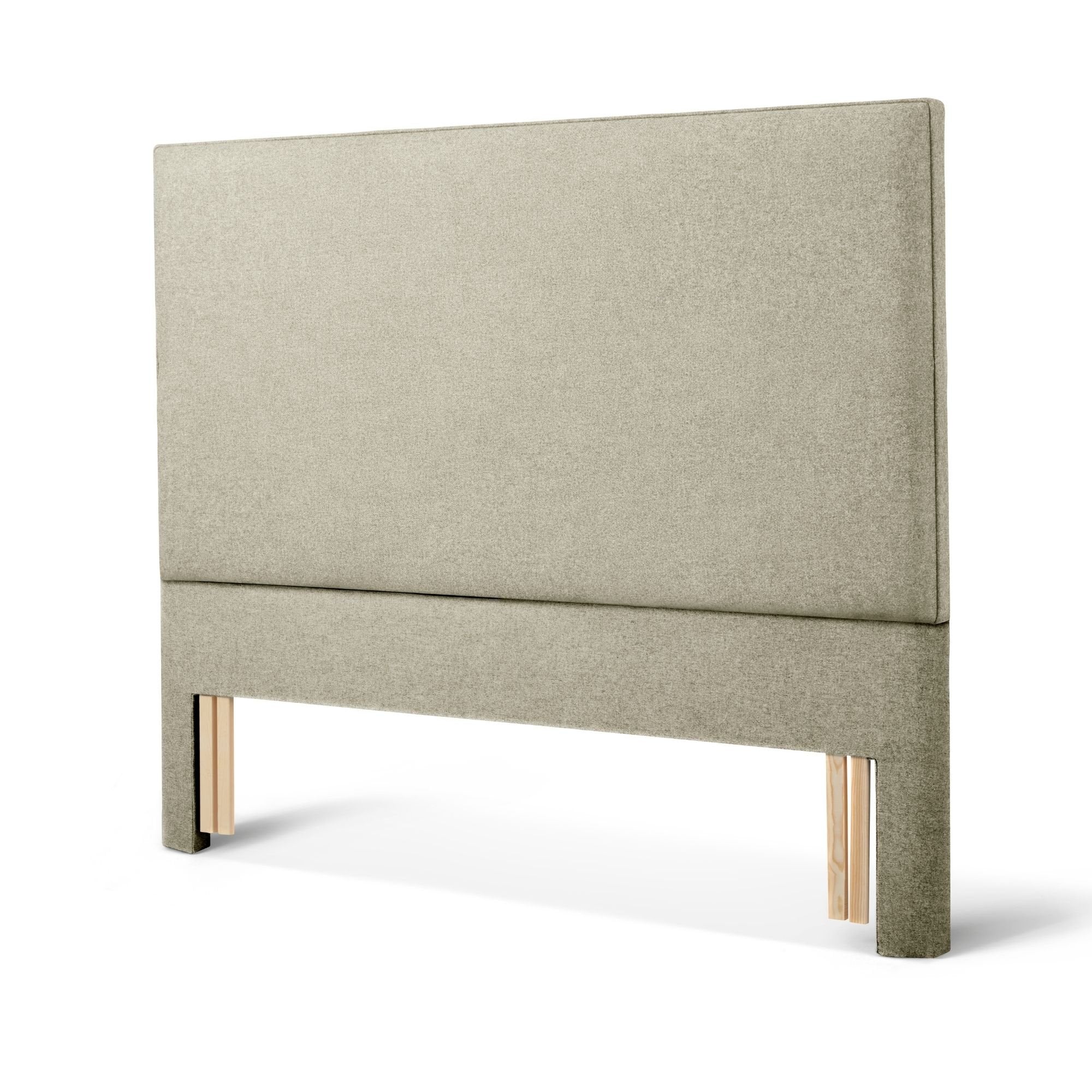 The Woolroom Broadway Floor Standing Headboard in Light Grey upholstery can be added seamlessly to a bed.