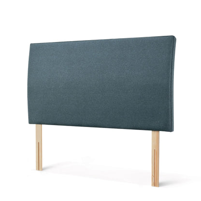 The Woolroom Coleton Strutted Headboard with a soft curve in Hemlock blue upholstery is bed-fixed and 100% British wool.