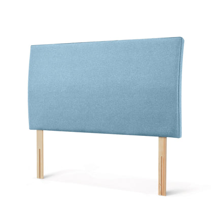 The Woolroom Coleton Strutted Headboard with a soft curve in Juniper light blue upholstery is bed-fixed and 100% British wool.