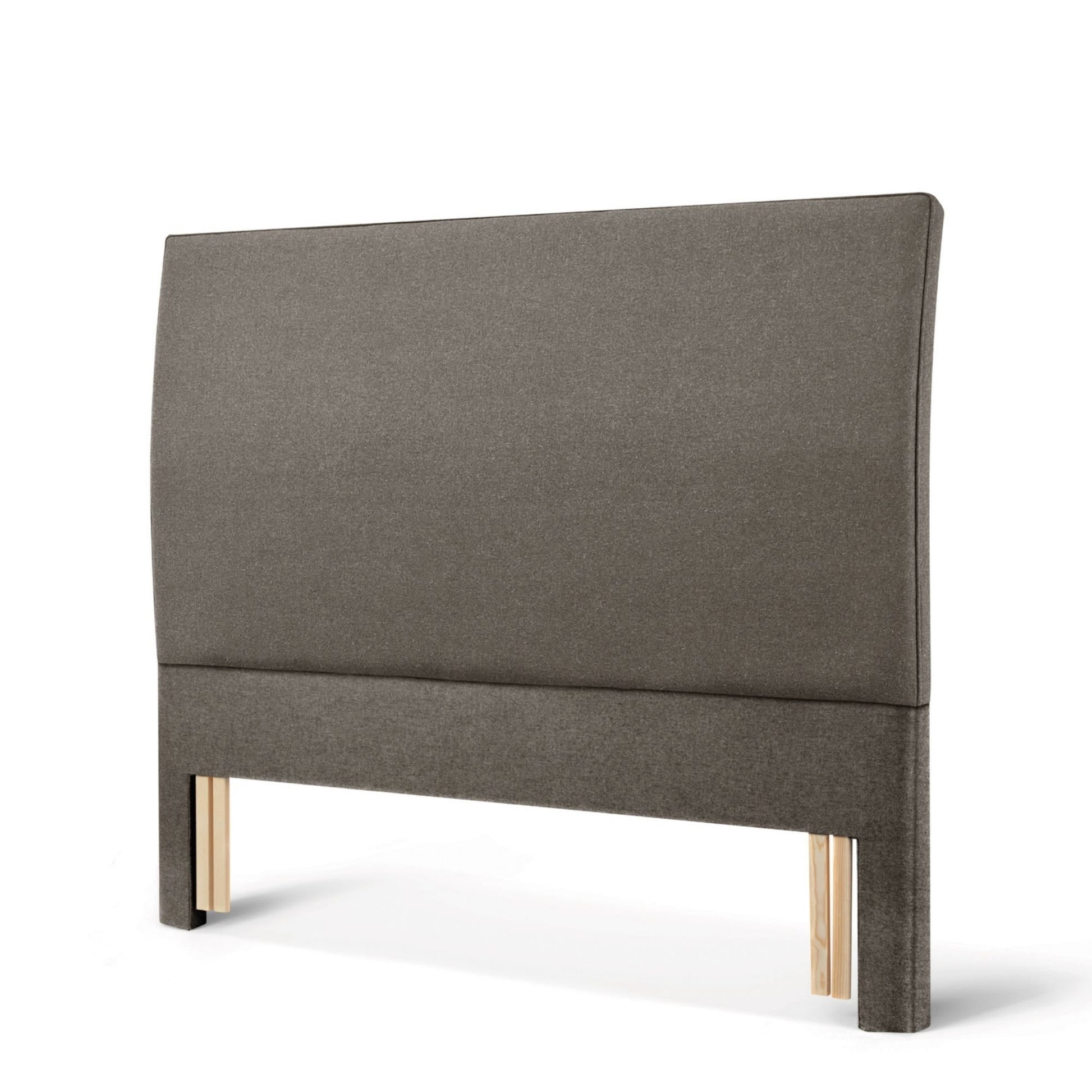 The Woolroom Coleton Floor Standing Headboard in dark grey upholstery has a soft curve and is 100% British wool. 