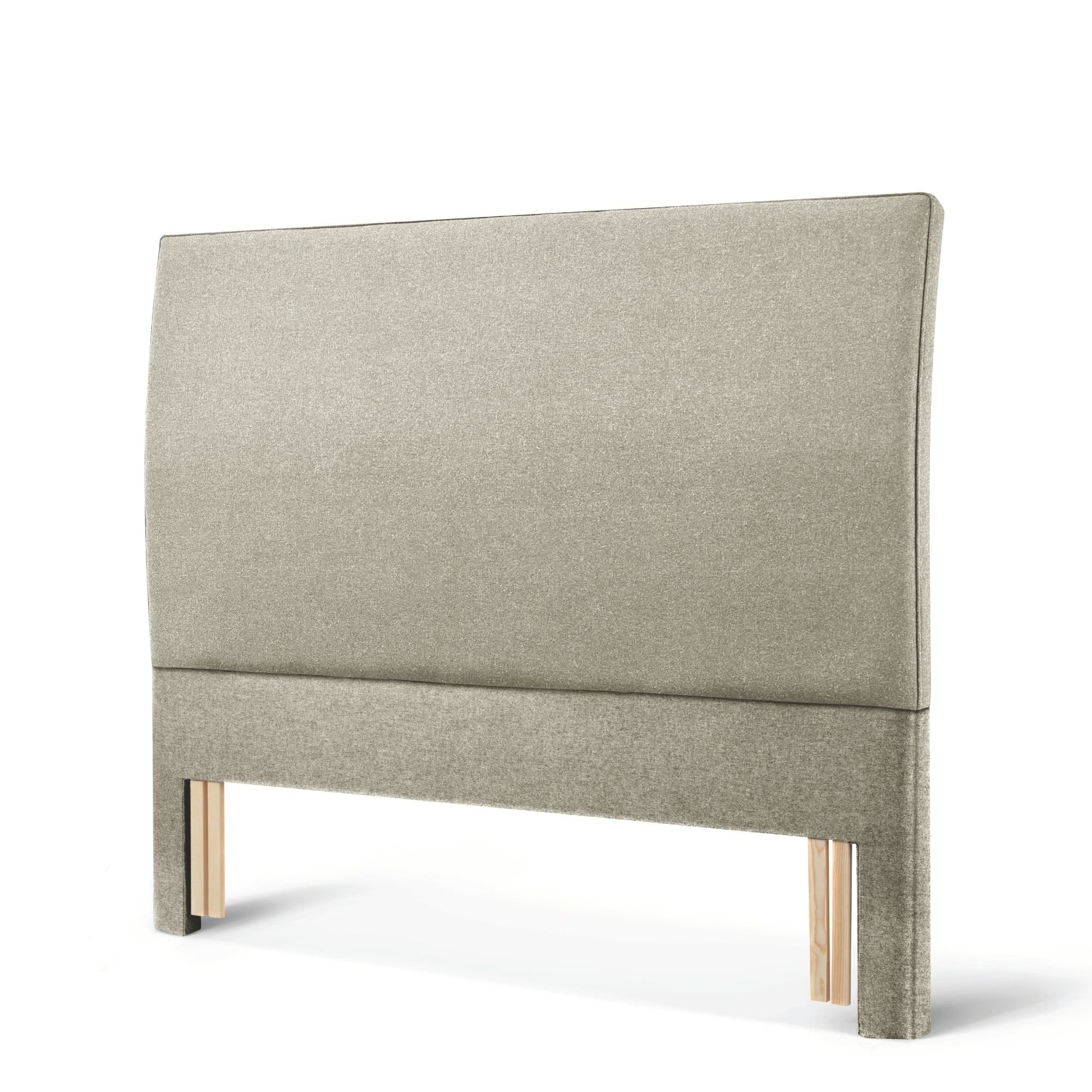 The Woolroom Coleton Floor Standing Headboard in light grey upholstery has a soft curve and is 100% British wool. 