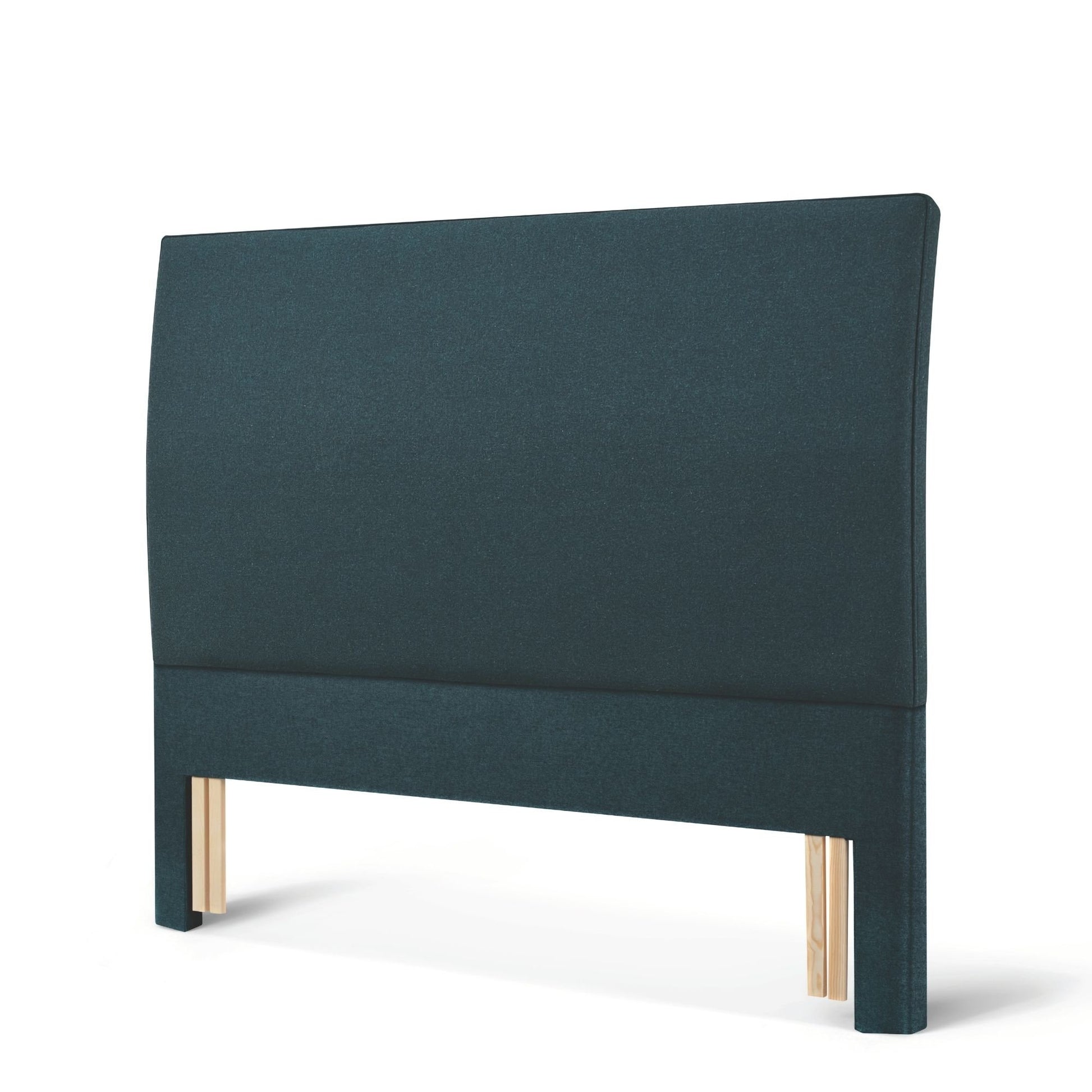 The Woolroom Coleton Floor Standing Headboard in Pine dark green upholstery has a soft curve and is 100% British wool. 