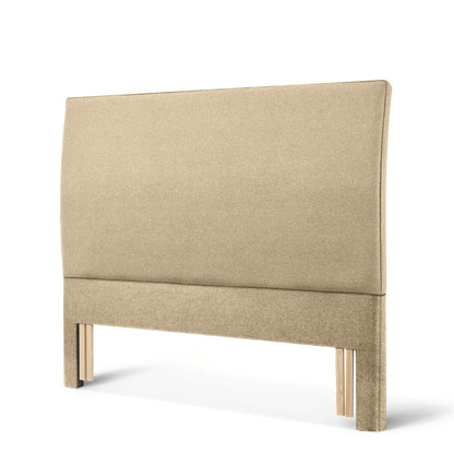 The Woolroom Coleton Floor Standing Headboard in Walnut brown upholstery has a soft curve and is 100% British wool. 