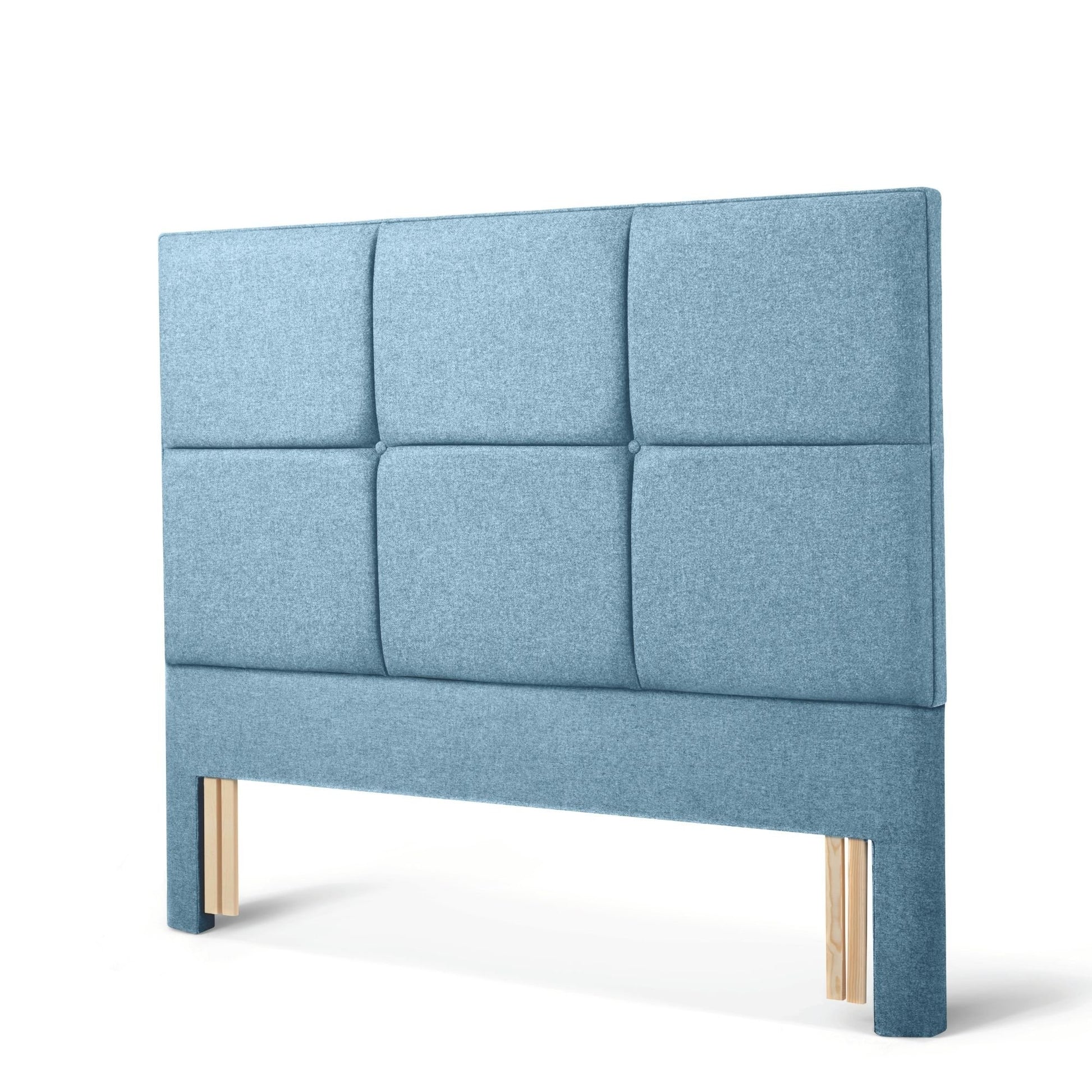 The Woolroom Goddards Floor Standing Headboard in Juniper light blue has upholstered panels and is a floor standing option.