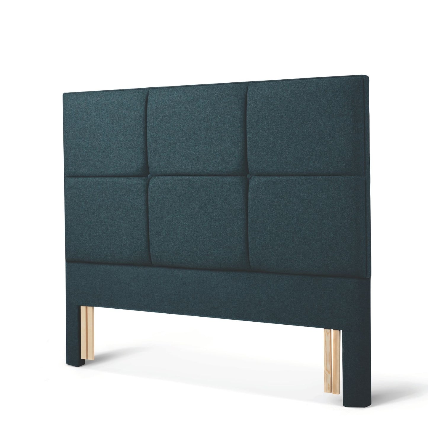 The Woolroom Goddards Floor Standing Headboard in Pine dark green has upholstered panels and can be added seamlessly to a bed.
