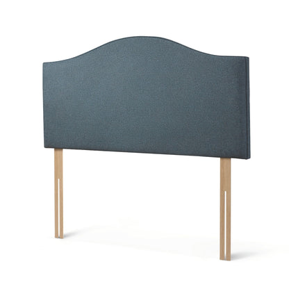 The Woolroom Hidcote Strutted Headboard in Hemlock blue is a classic curved and upholstered bed-fix option for any bed.
