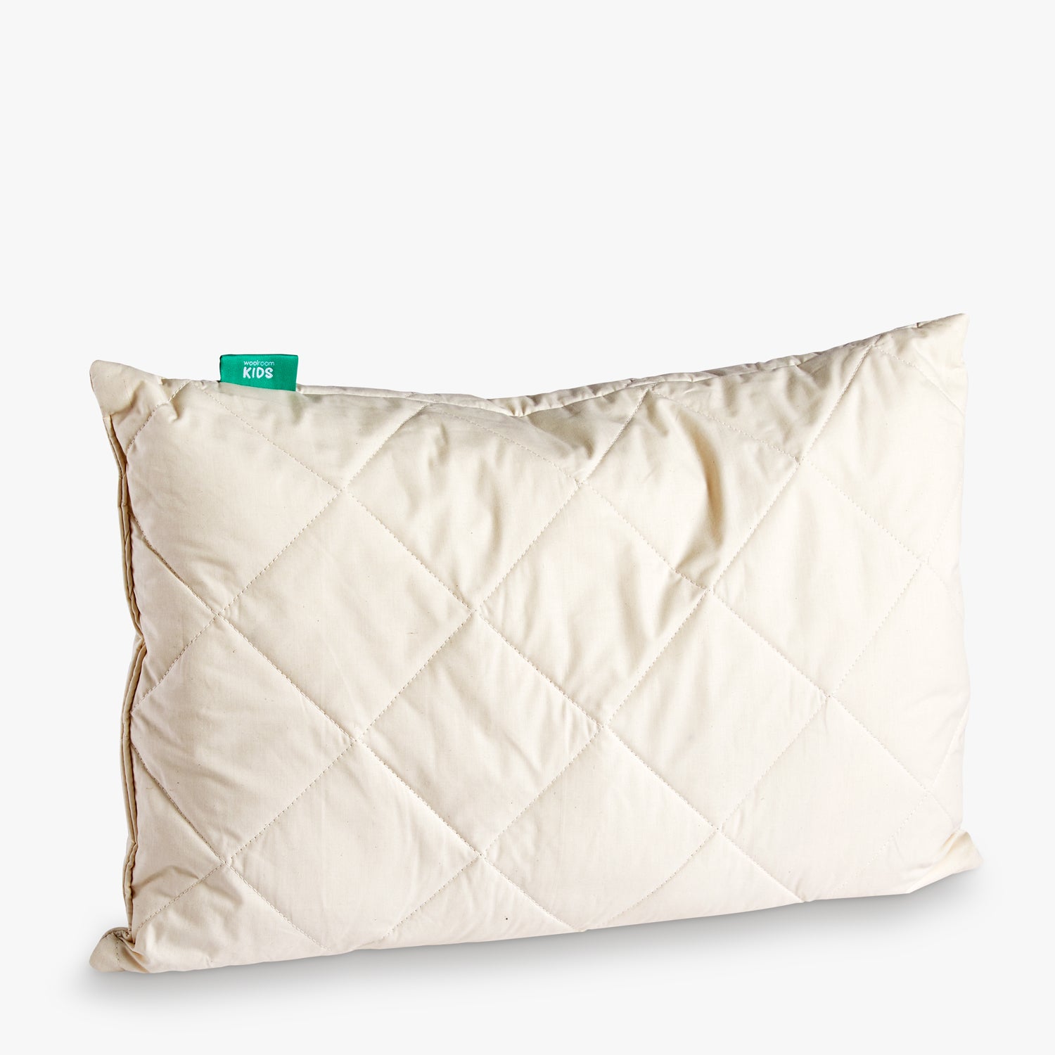 A Deluxe Washable Wool Kids Cot Pillow without a pillowcase showing the quilted outer cover.
