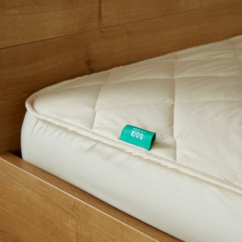 Product image of Deluxe Washable Wool Kids Mattress Protector by Woolroom – premium kids bedding