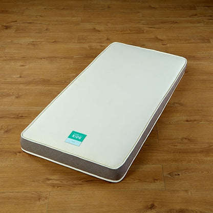 The Woolroom Kids Mattress without a cover or sheet showing the thickness and the quilted edges, available in two sizes.