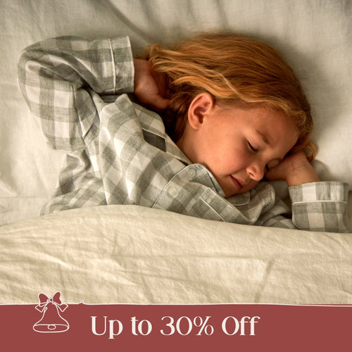 Image of a green Woolroom kids label sewn into the edge of a kids pillow