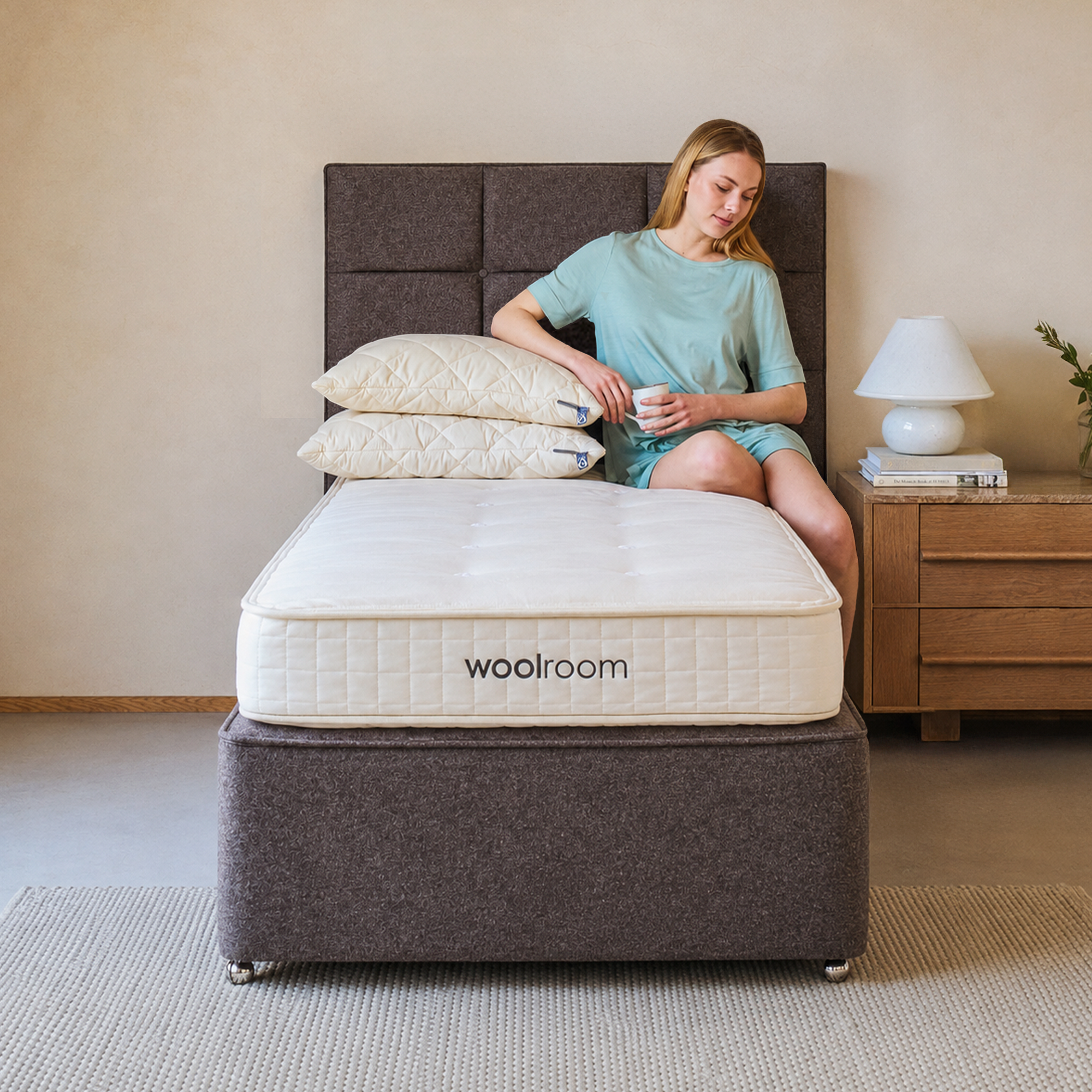 Kid sitting on Woolroom mattress