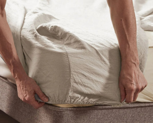 man fitting pebble colour sheet