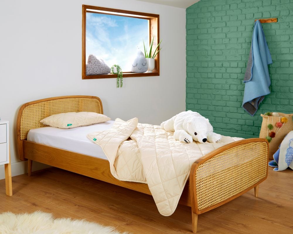 Bedroom with a wooden bed, white bedding, and decorative items.