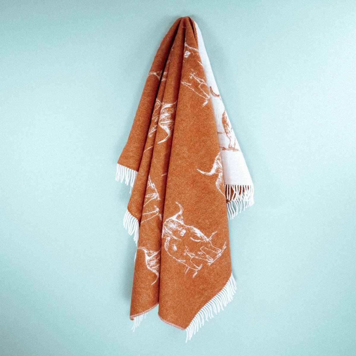 Wild and Wool Highland Coo Wool Throw - Rust from Woolroom – natural wool throws for better sleep