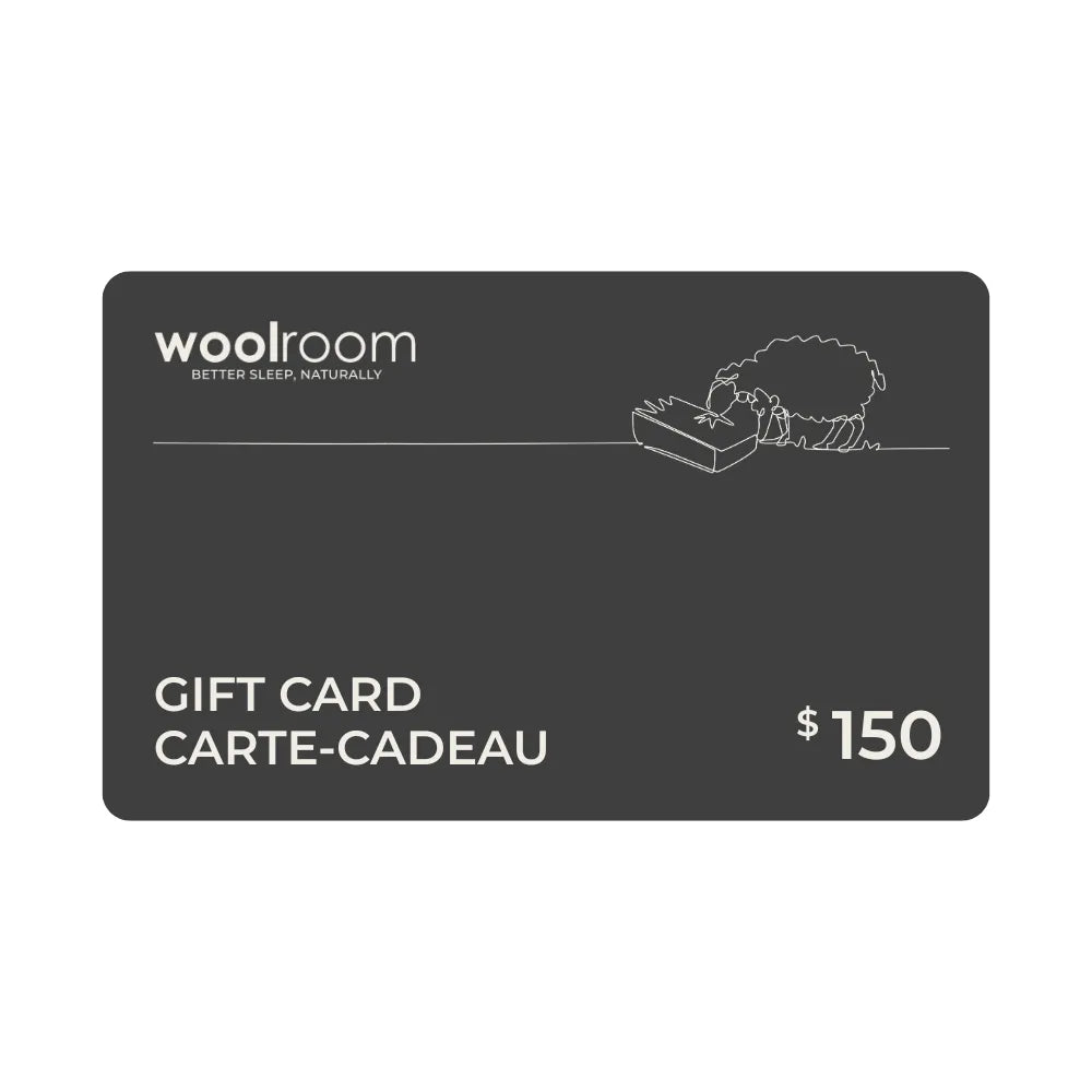 A dark gray Woolroom gift card with white text reading 'GIFT CARD CARTE-CADEAU', '$150', and the Woolroom logo, shown on a plain white background.