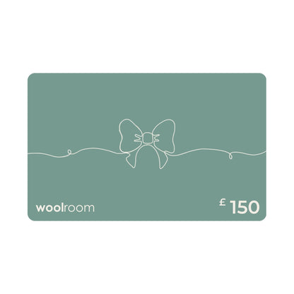 A £150 Woolroom gift card in a muted sage green color, featuring a minimalist white line art bow design in the center, with the 'woolroom' brand name on the bottom left and '£150' on the bottom right.