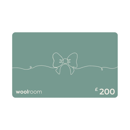 A £200 Woolroom gift card in a muted sage green color, featuring a minimalist white line art bow design in the center, with the 'woolroom' brand name on the bottom left and '£200' on the bottom right.