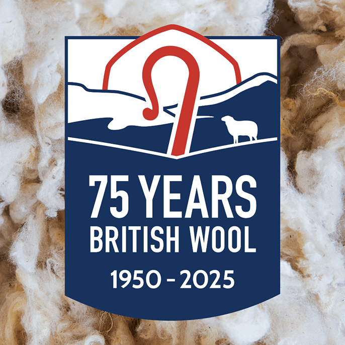A commemorative British Wool 75 Years 1950-2025 logo badge centered over a textured background of white and beige wool fibers. The badge features a red wool staple symbol, a white sheep silhouette, and blue hills, with white text reading '75 YEARS BRITISH WOOL 1950 - 2025'.