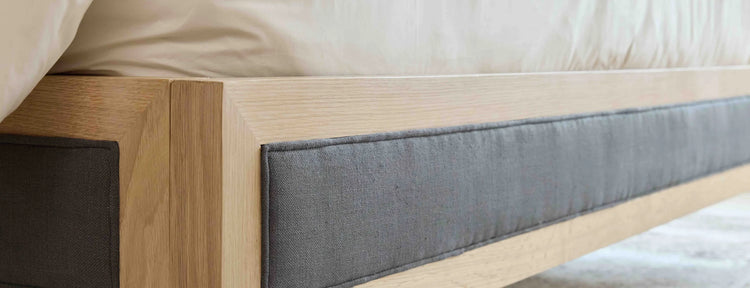 Banner view of white oak frame joinery and charcoal upholstered rail on the Victoria bed