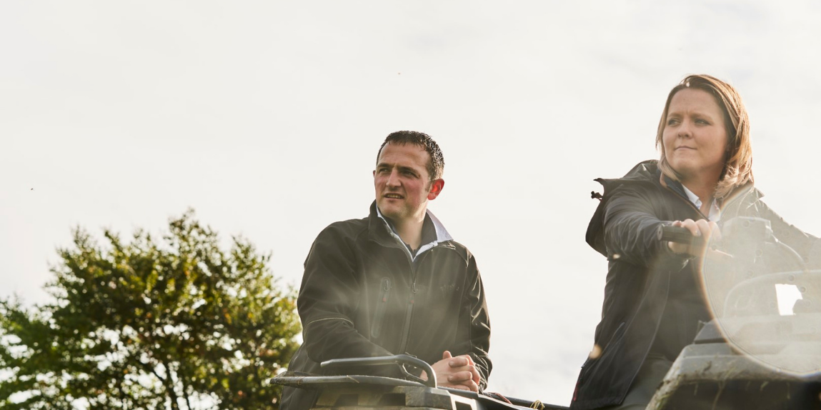 two farmers on a quadbike