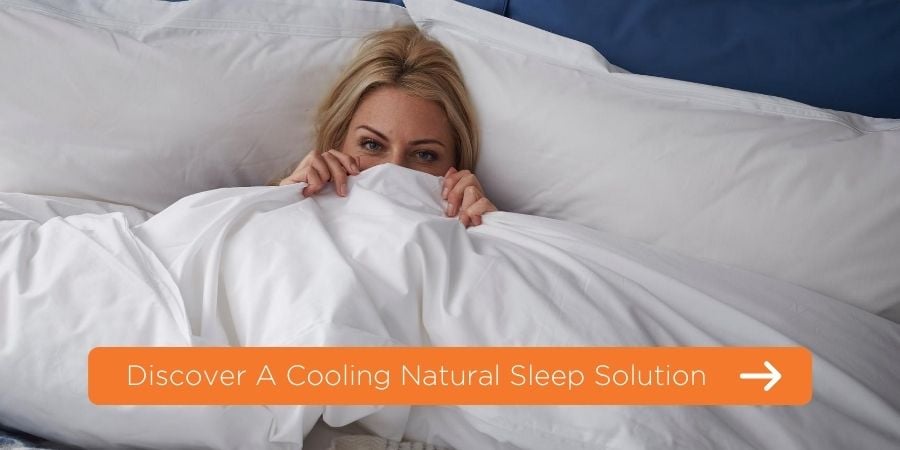 Women in bed with a link to a cooling natural sleep solution