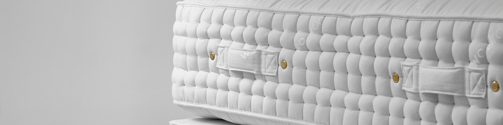 close up side image of wool mattress