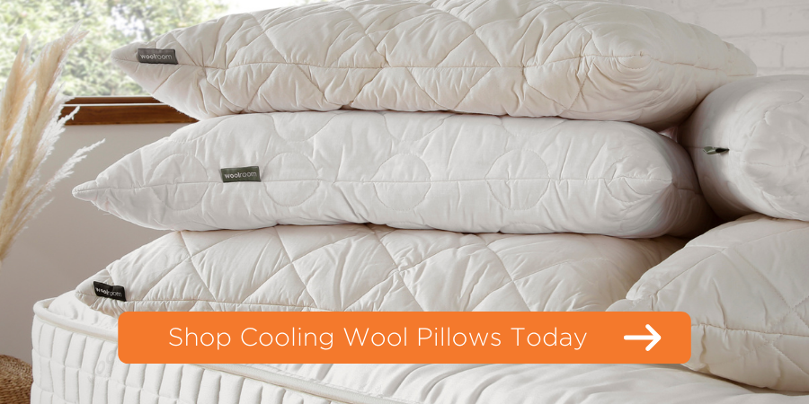 wool pillows stacked on top of each other