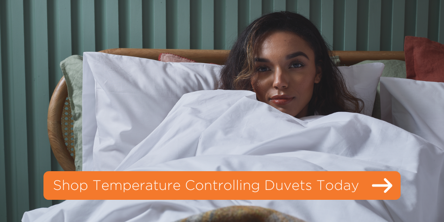 women in bed with a link to shop temperature controlling duvets