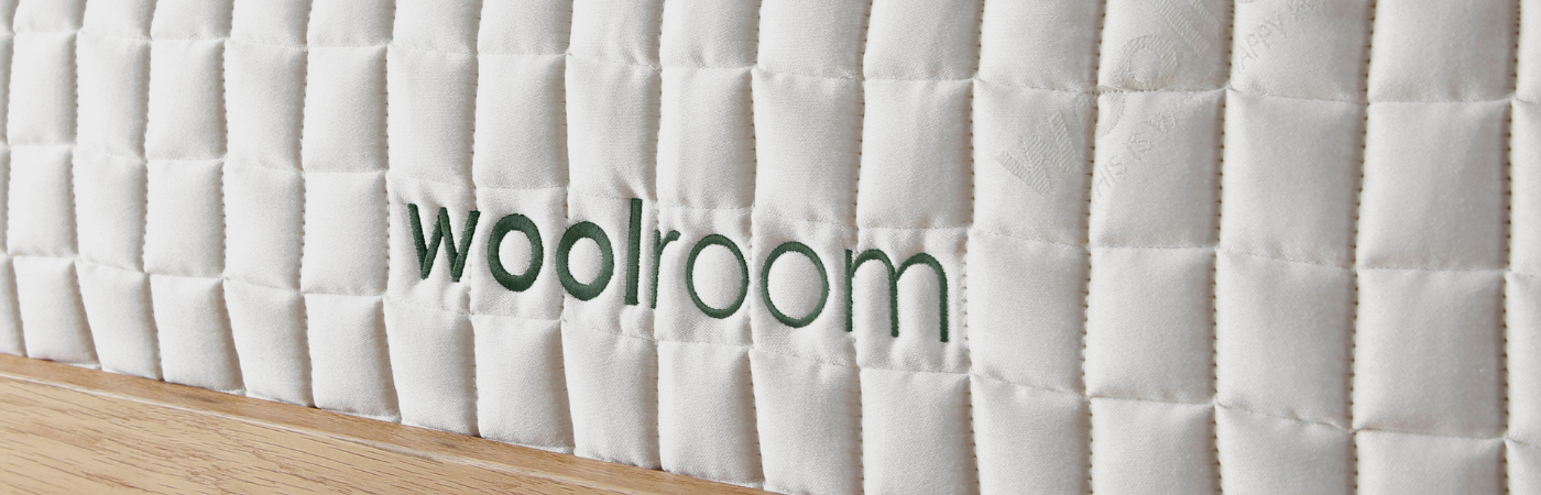 close up of wooly mattress logo